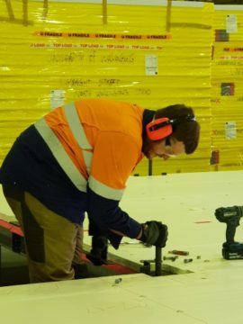 Andrew attaches piers- Team UOW Desert Rose House Construction