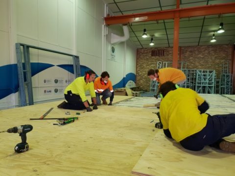 Installing plywood floors- Team UOW Desert Rose House Construction