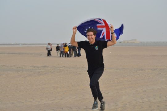 Luca proudly waving the Australian flag at the SDME2018 Solar Hai