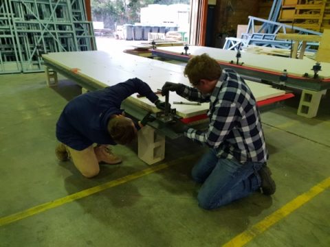 Simon and Aaron attach piers- Team UOW Desert Rose House Construction